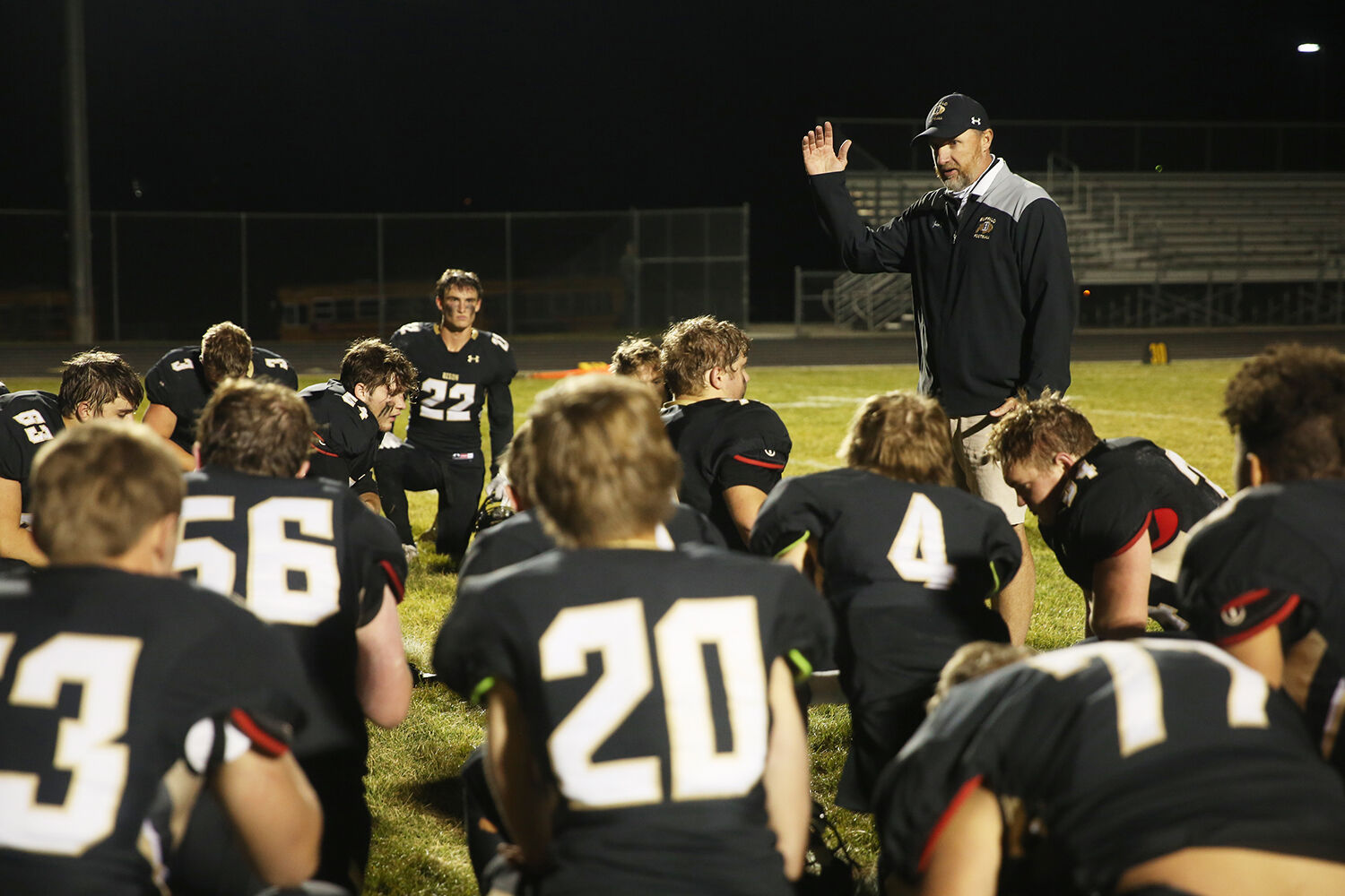 Rob Hammond reflects with his team after the conclusion of the game